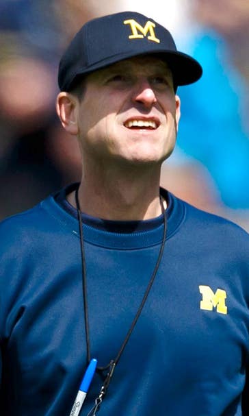 Harbaugh discusses football dreams, helmet stickers